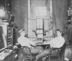 My grandfather (left) at work